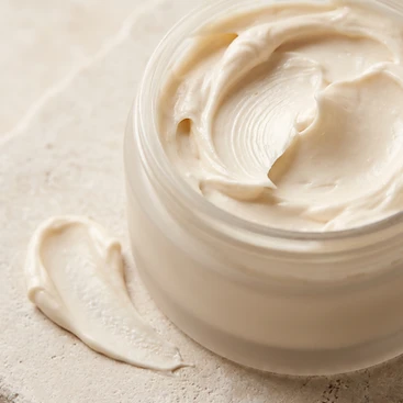 Whipped white body butter in a jar