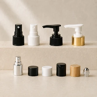 Assorted caps, pumps and closures in black, white, gold, silver and bamboo