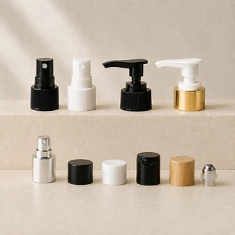 Assorted caps, pumps and closures in black, white, gold, silver and bamboo