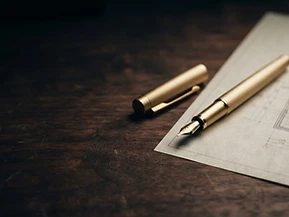 Retirement planning worksheet and gold fountain pen