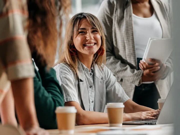 Care team gathered around a table in a casual conference room
