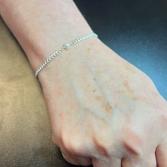 Silver permanent chain bracelet with single white pearl charm by Oh She Linked
