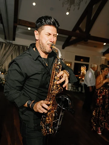 Saxophonist Al Cutri performing live during a wedding reception at Timber Banks Country Club