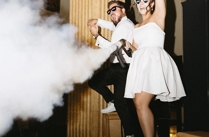 Packed dance floor with CO₂ effects at a DJ Mike Melice wedding
