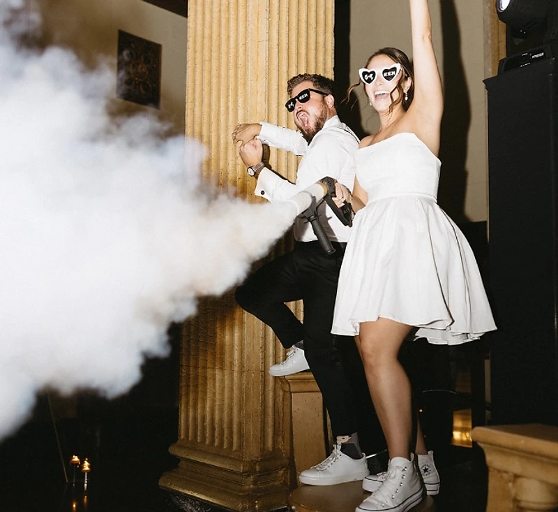 Packed dance floor with CO₂ effects at a DJ Mike Melice wedding
