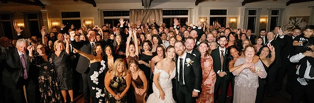 Packed dance floor with vaulted timber ceilings and chandeliers at a Timber Banks Country Club wedding