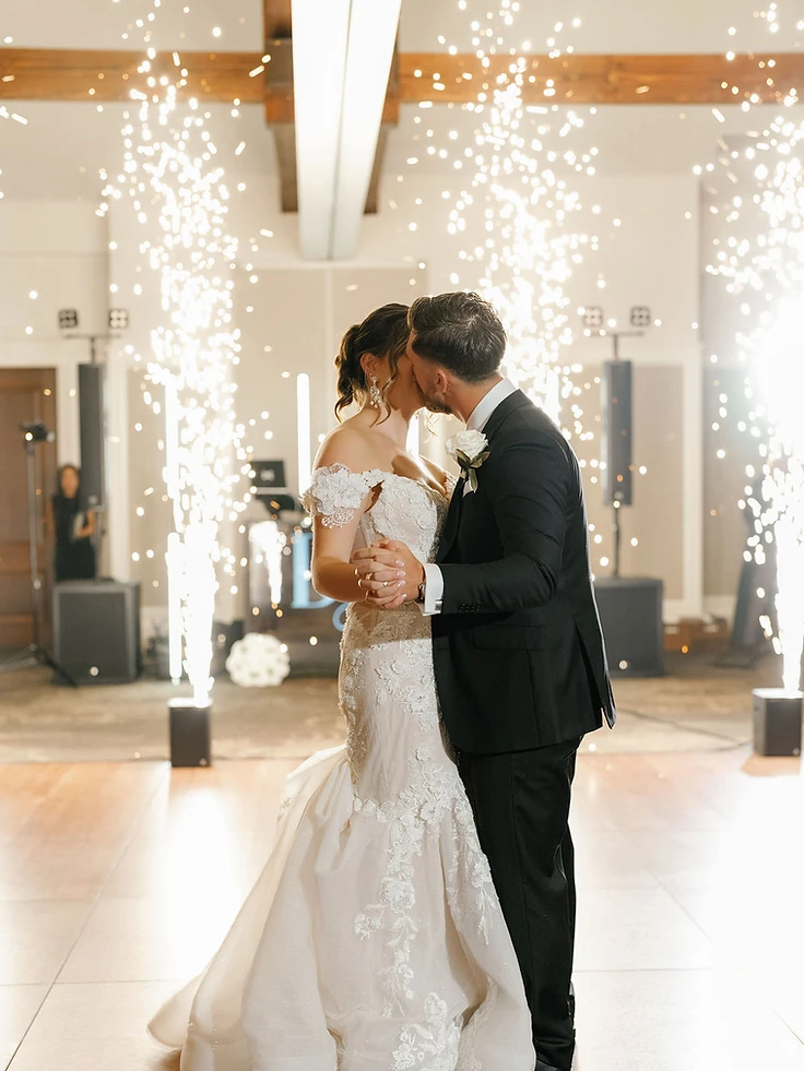 Bride and groom sharing a first dance surrounded by Cold Sparks at Timber Banks Country Club