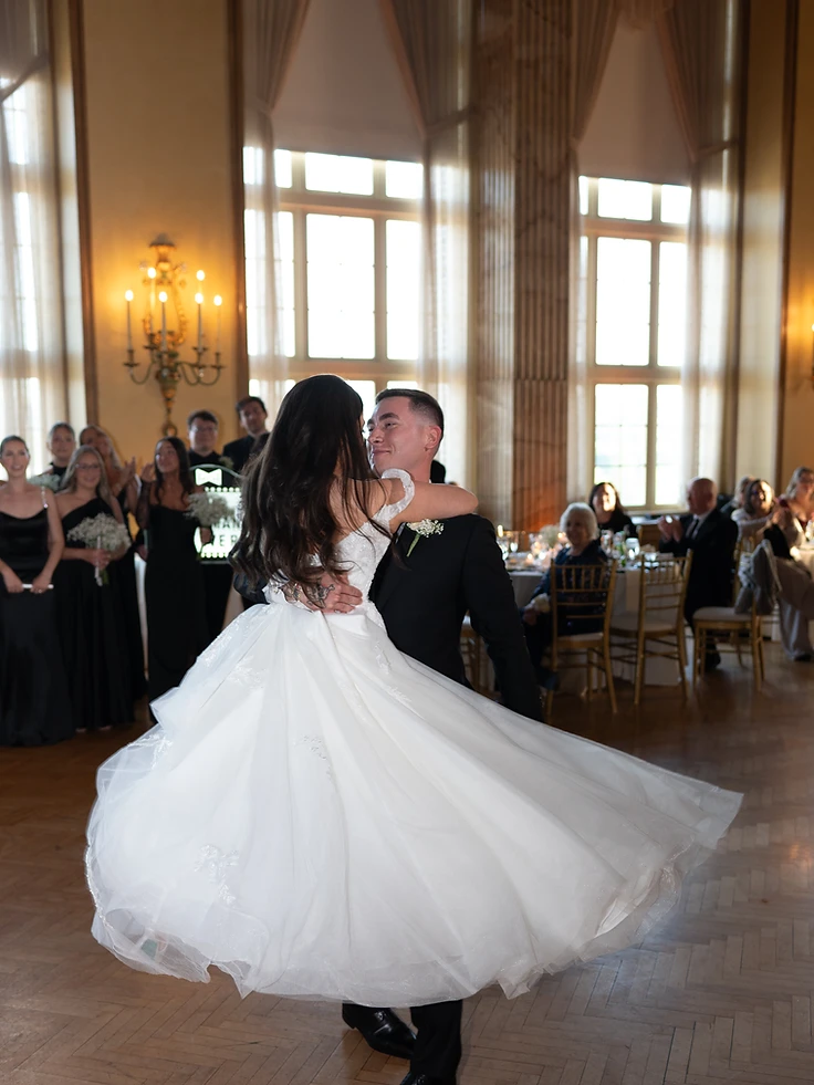 Conlan lifting Madelyn during their choreographed first dance in the Grand Ballroom