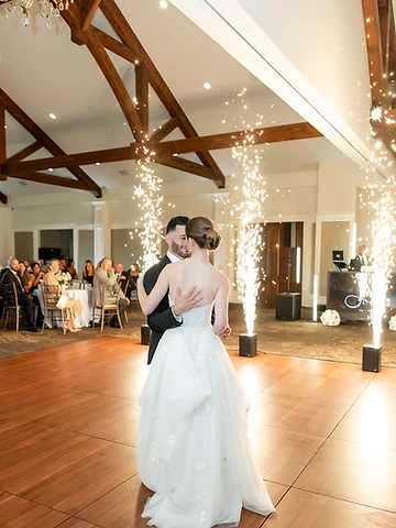 Bride and groom dancing surrounded by Cold Sparks at their Timber Banks Country Club wedding