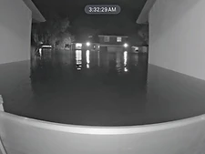 Fortress flood barrier holding back floodwater during a hurricane
