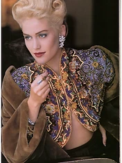 Denice D. Lewis in a vintage editorial portrait with victory-roll hair and an embellished jacket