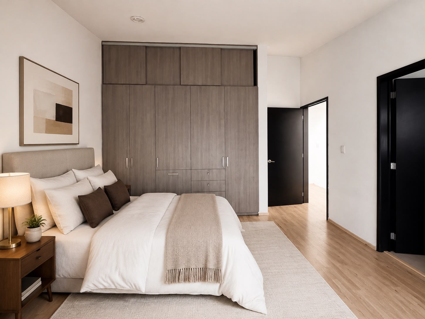 Recámara con cabecera tapizada, vestidor de madera y mesas de noche en proyecto entregado TEMBO