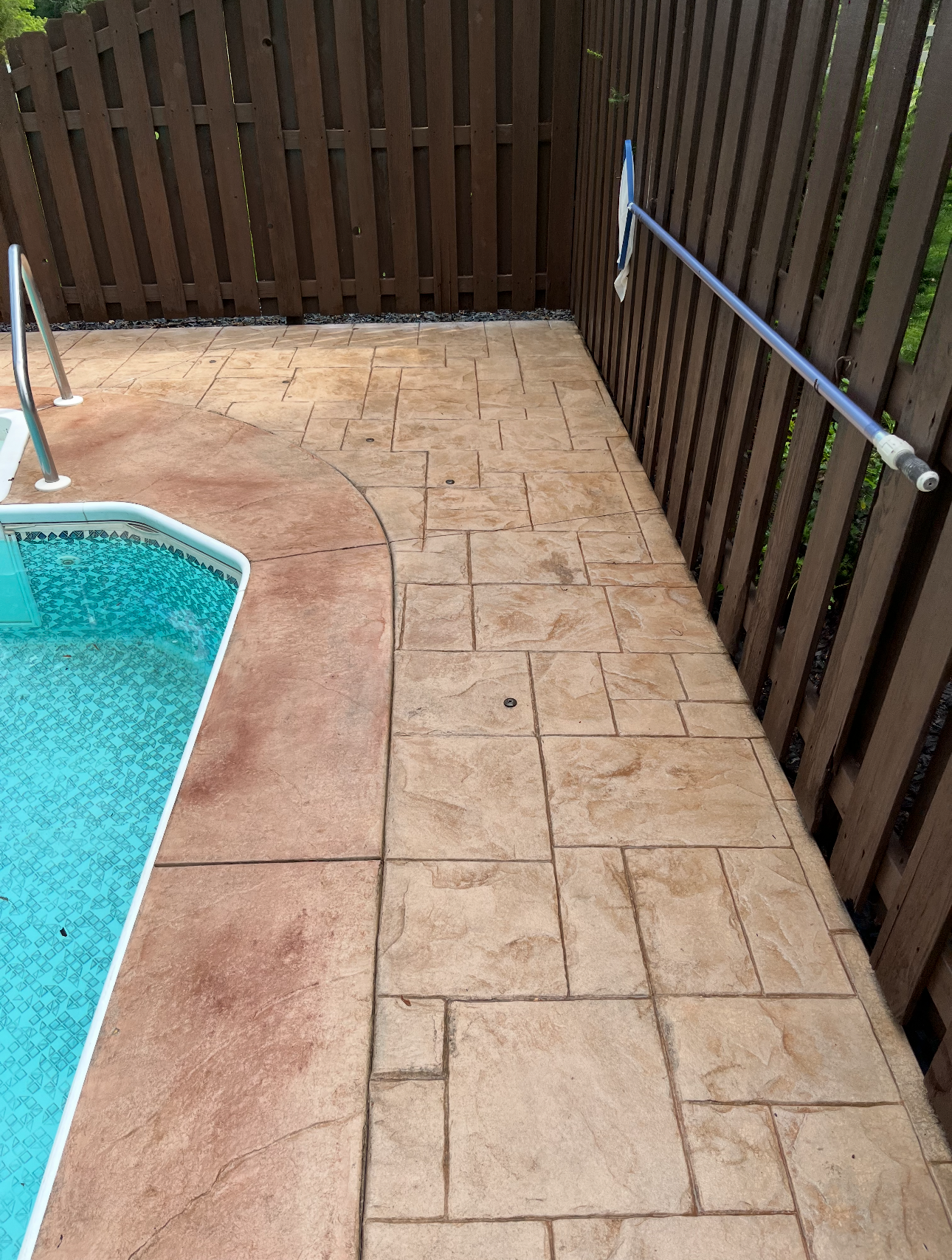 Stamped concrete poolside patio cleaned by A&P Wash Services