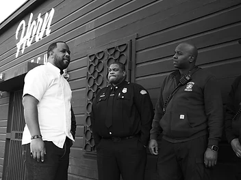 Matt Horn with first responders and community members in front of Horn Barbecue
