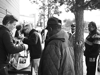 A volunteer facing the distribution line at the turkey giveaway