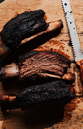 Bone-in beef ribs on a cutting board