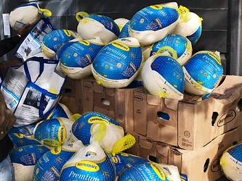 A pile of frozen Butterball turkeys stacked on boxes during the giveaway
