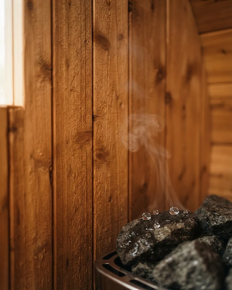 Macro detail of vertical cedar planks of the barrel sauna