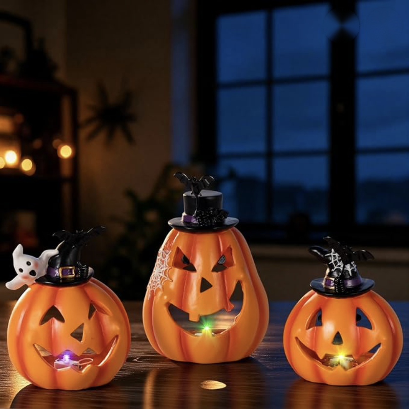 Lighted jack-o-lantern decorations with witch hats