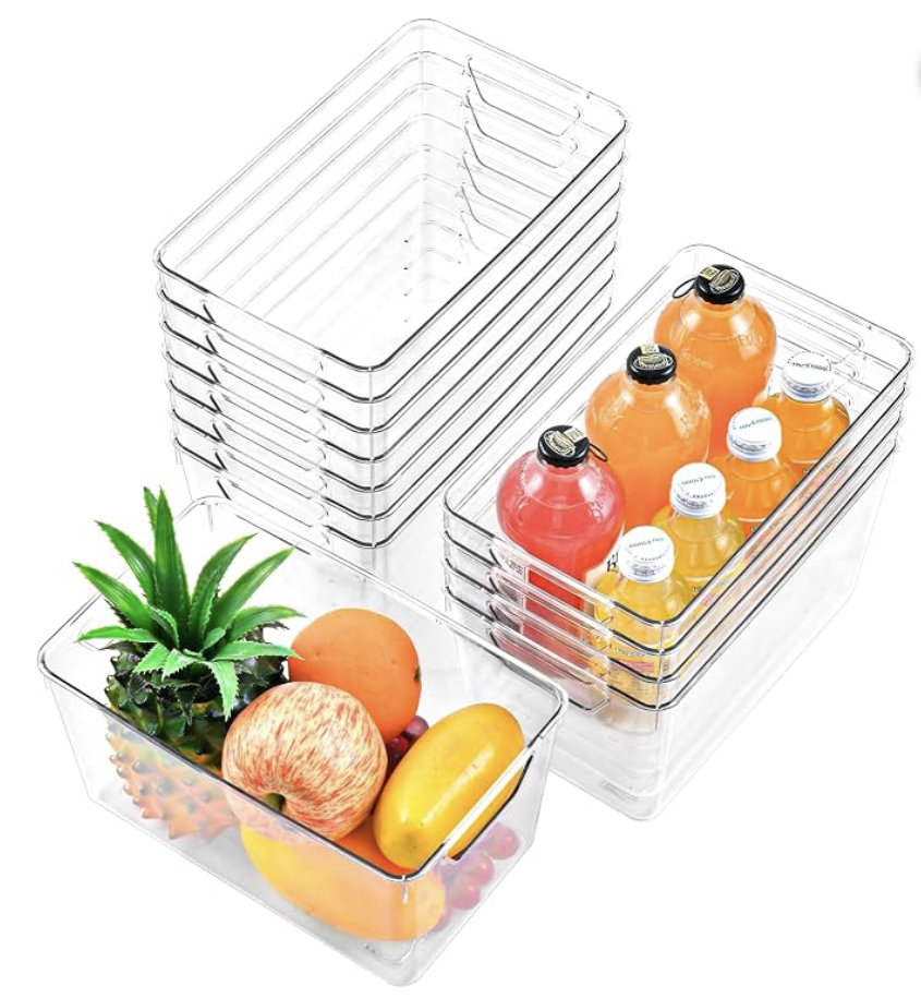 Clear stackable pantry storage bins with handles holding fruit and bottled drinks