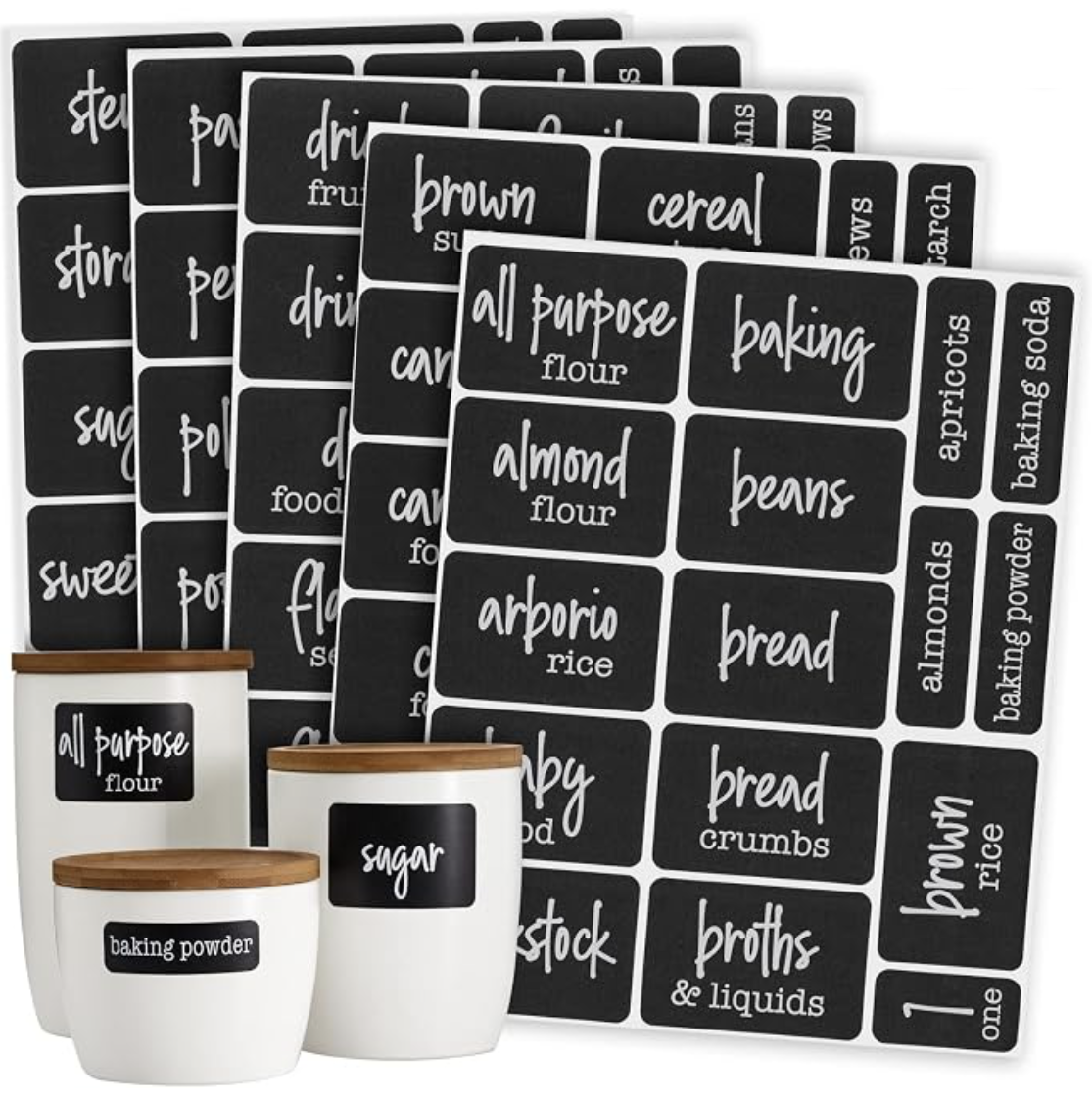 Black chalkboard-style pantry labels on sheets and applied to white storage jars