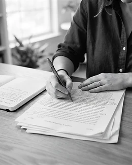 The master's studio — hands working over a manuscript