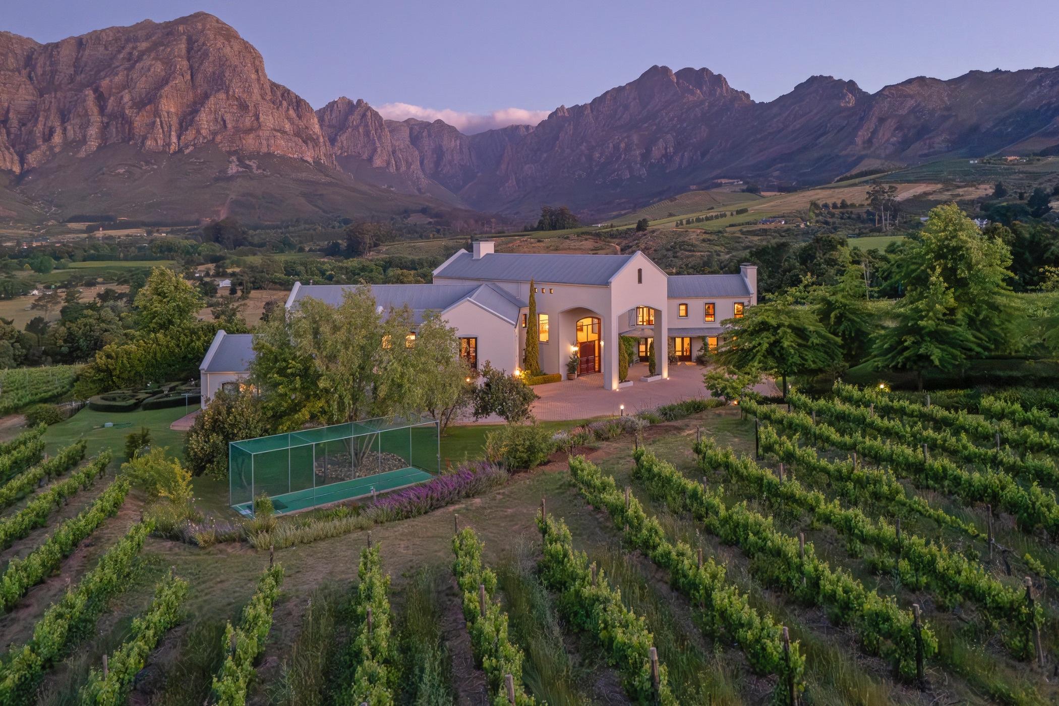 Vineyard villa at dusk, Drakenstein mountains