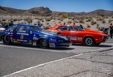 Dragster and crew preparing in the Top Gun Dragstrip staging lanes