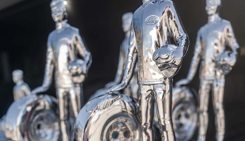 Rows of racing trophies ready for presentation at Top Gun Dragstrip