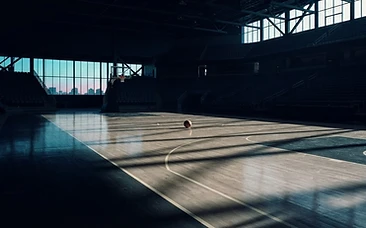Empty basketball court at dawn