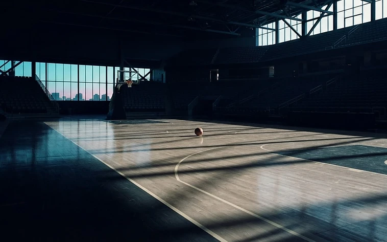 Empty basketball court at dawn