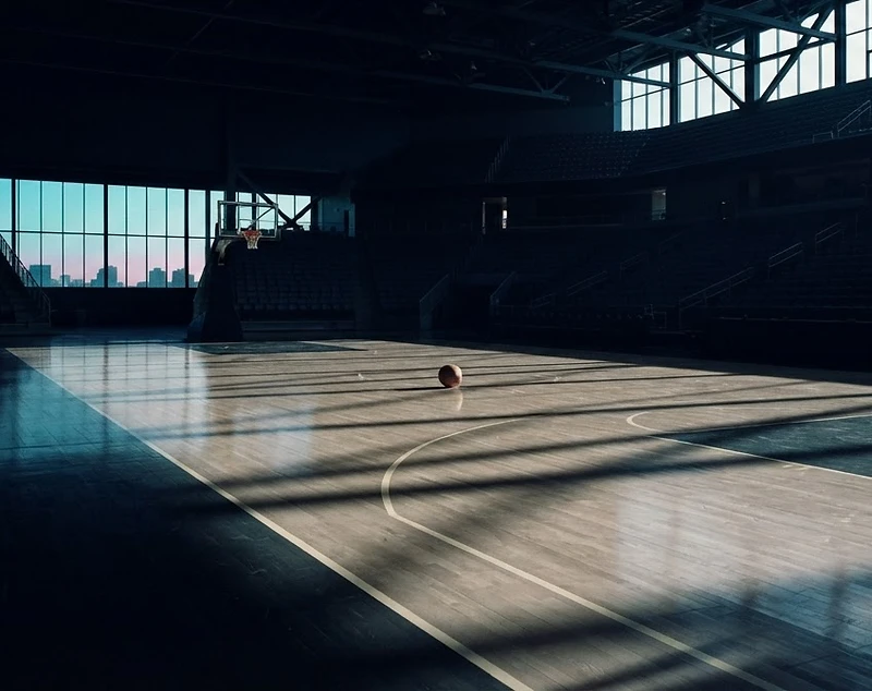 Empty basketball court at dawn