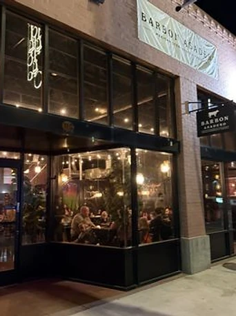 Barbon Asadero storefront glowing at night in Buckeye, AZ