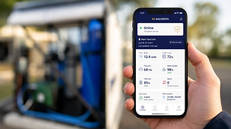Salventa DMS dashboard on a smartphone, with a deployed unit in the background