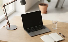 Professional workspace showing a laptop and office tools symbolizing business growth and digital strategy.