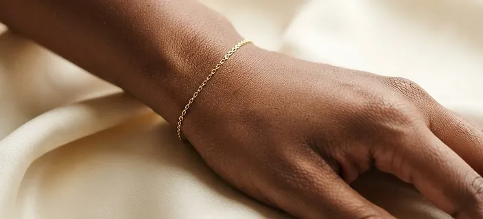Permanent gold chain bracelet on wrist