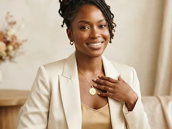 Small-business owner wearing a custom branded pendant