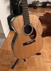 Tim's acoustic guitar with a natural spruce top