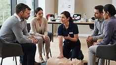 First-aid training with a mannequin in a seminar room