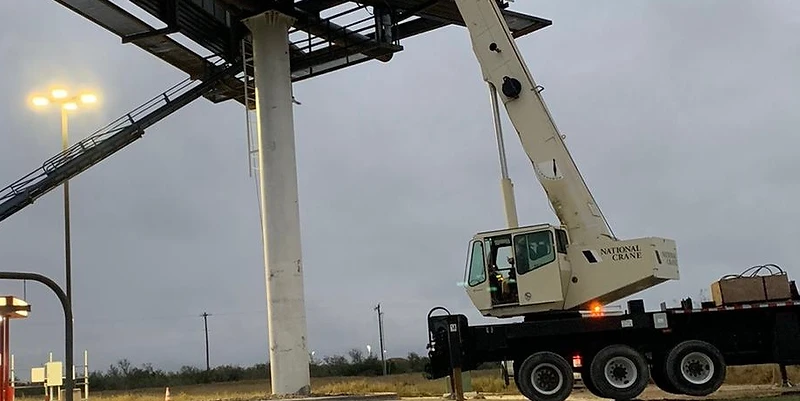 Cortes Contracting Services billboard structure installed and rigged with crane support