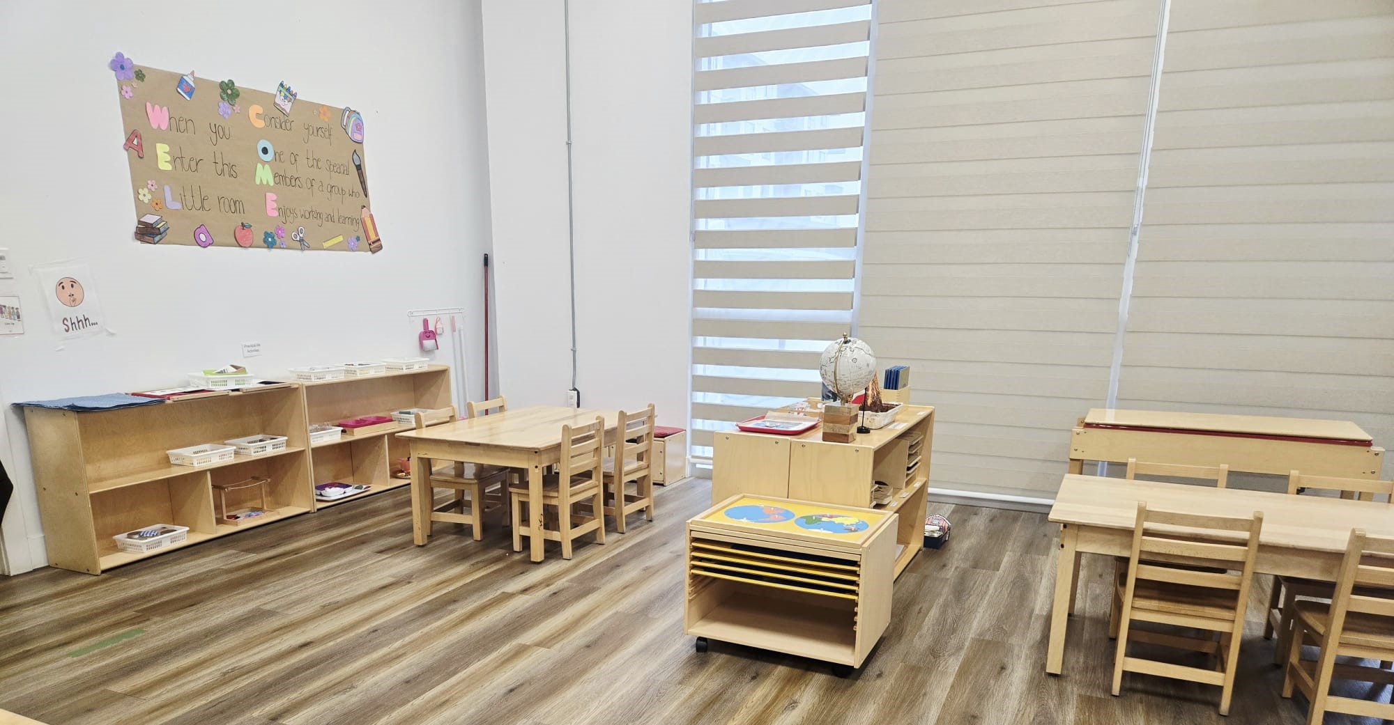 Junior kindergarten classroom with welcome sign and globe at Kidzville