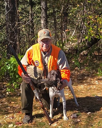 Dr. Bob Eldridge and a held bird