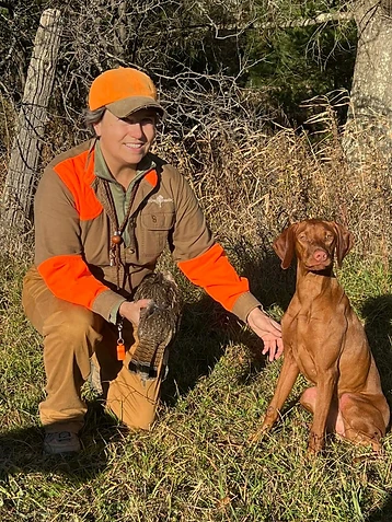 A good dog and a held bird
