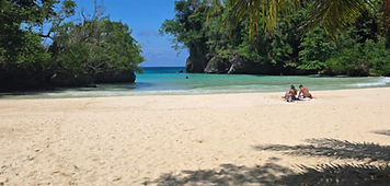 Couple relaxing together on a tropical beach