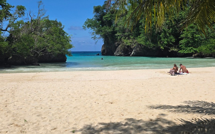 Couple relaxing on a tropical beach
