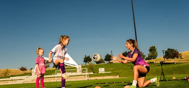 Female soccer athlete training on the field