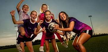 Coach Ana training a young female soccer athlete one-on-one