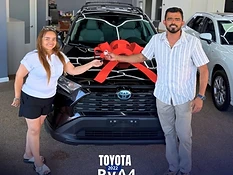 Johana B. receiving their vehicle