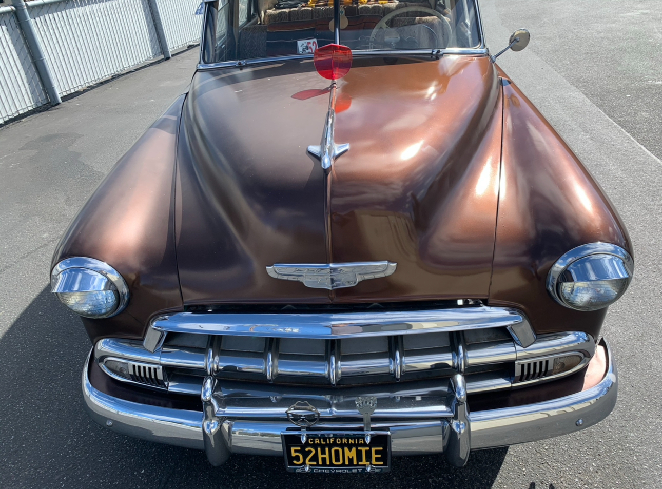 Vintage bronze Chevrolet sedan with high-gloss reflective paint