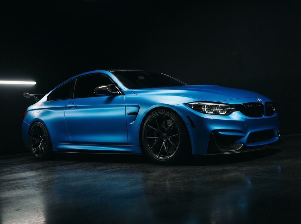 Luxury vehicle in a dark detailing studio